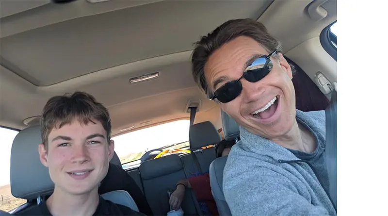 Aren Elliott and the author share a light moment while driving through Colorado in 2018.