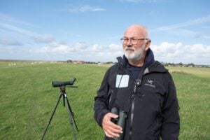 Klaus Melbye, director of the Wadden Sea Centre, surveys wildlife at a dike in Wadden Sea National Park.