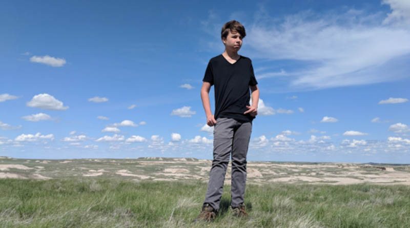 Iden Elliott uses his National Parks Pass to check out Badlands National Park, one of the 2,000 federal recreation sites accessible with our National Park Pass.
