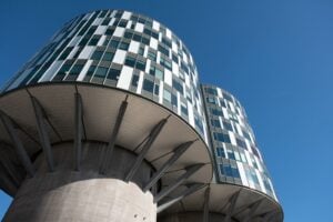 Two repurposed concrete grain silos in Copenhagen converted into modern office space, an example of the city's adaptive reuse of old industrial buildings.