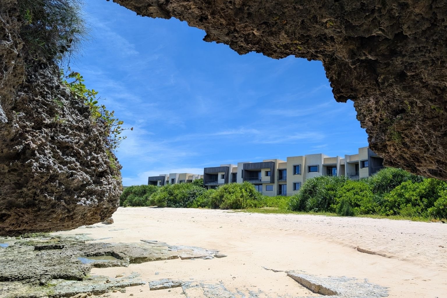 The turquoise water lapping against Okinawa's pebbled beach is so clear that you can see an occasional parrotfish streaking by. Just behind it, the Hoshinoya Okinawa's low-slung modernist villas blend into a landscape of gnarled fukugi trees and hibiscus. 