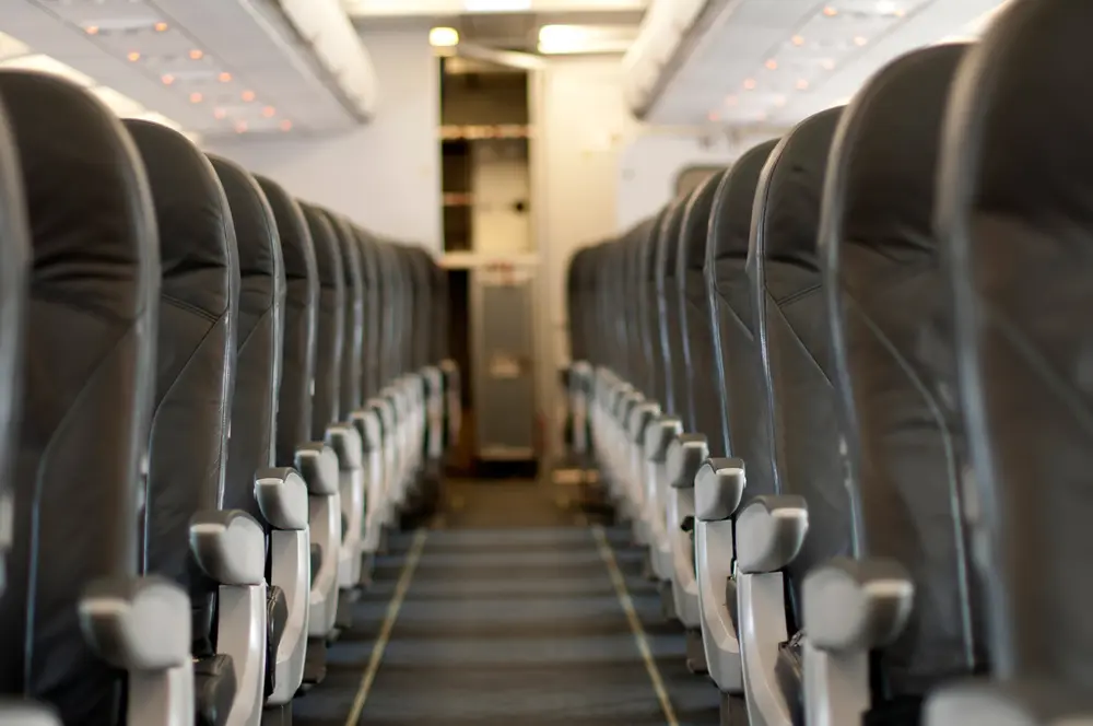 Many airlines are squeezing the seats in steerage closer together to make more money while lavishing elite customers with more perks.